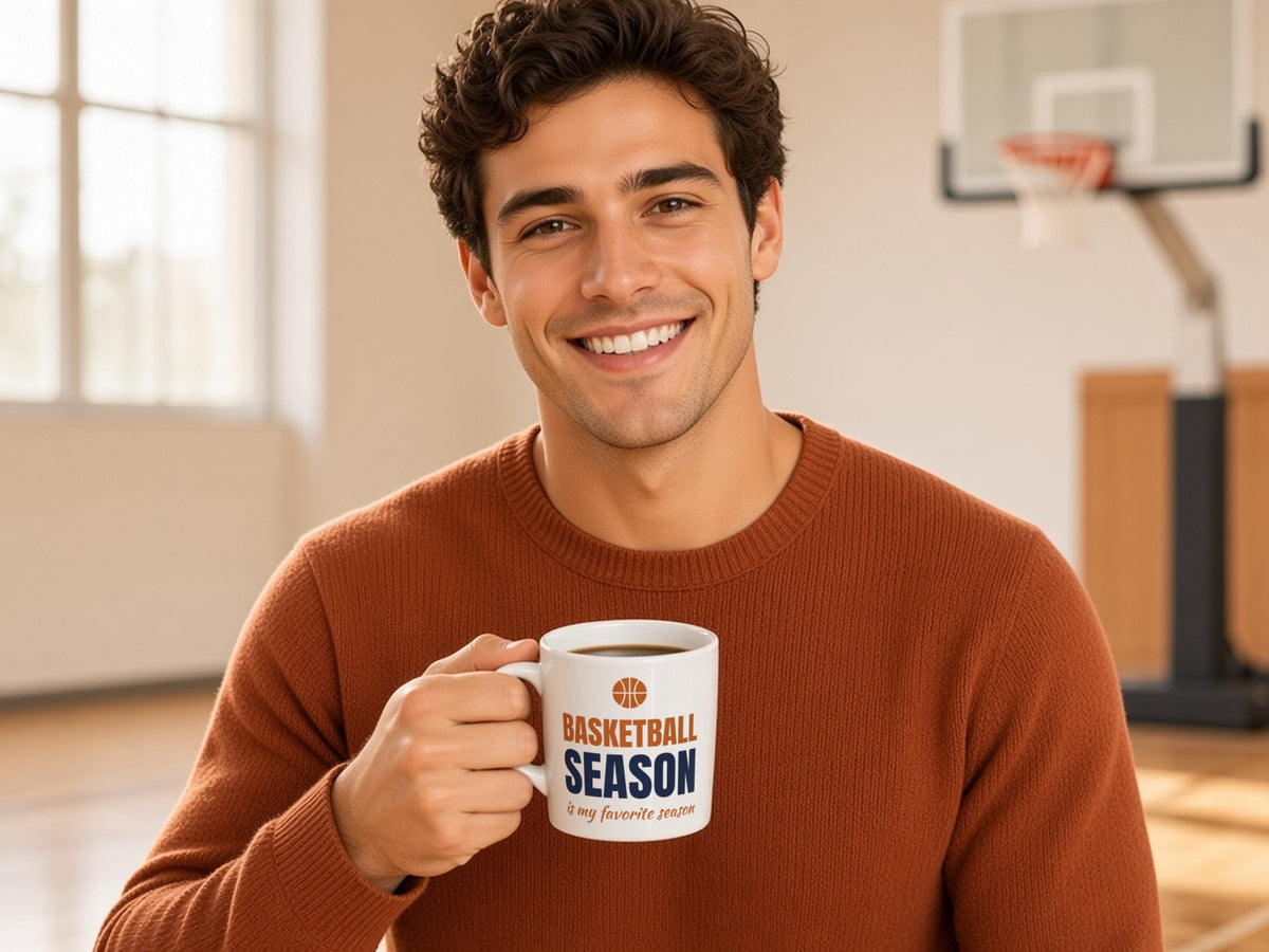 Basketball Season Is My Favorite Season Mug, Basketball Fan Coffee Mug, man in a rust sweater holding the mug in a sunny gym